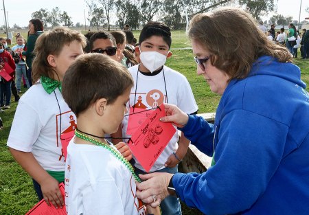 P.W. Engvall teacher Suzanne Ross checks students before the tour begins. 